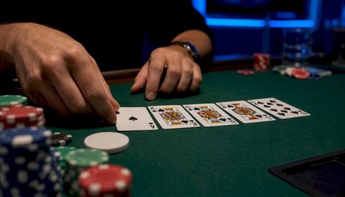 Royal Flush poker hand on green felt table