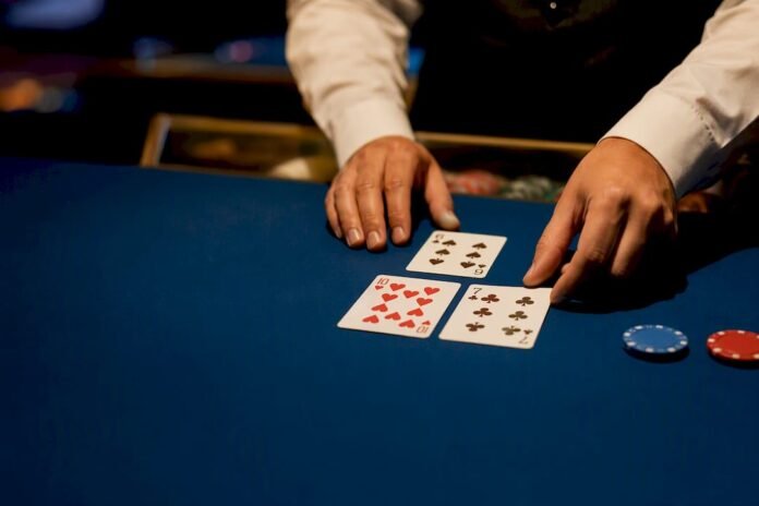 Dealer arranging blackjack cards on table